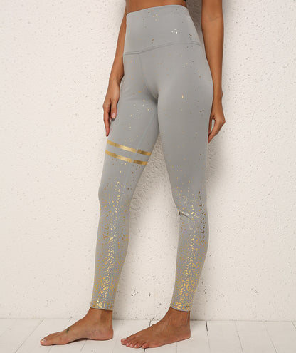 Stylish gold dot striped leggings lifestyle shot showing versatile activewear