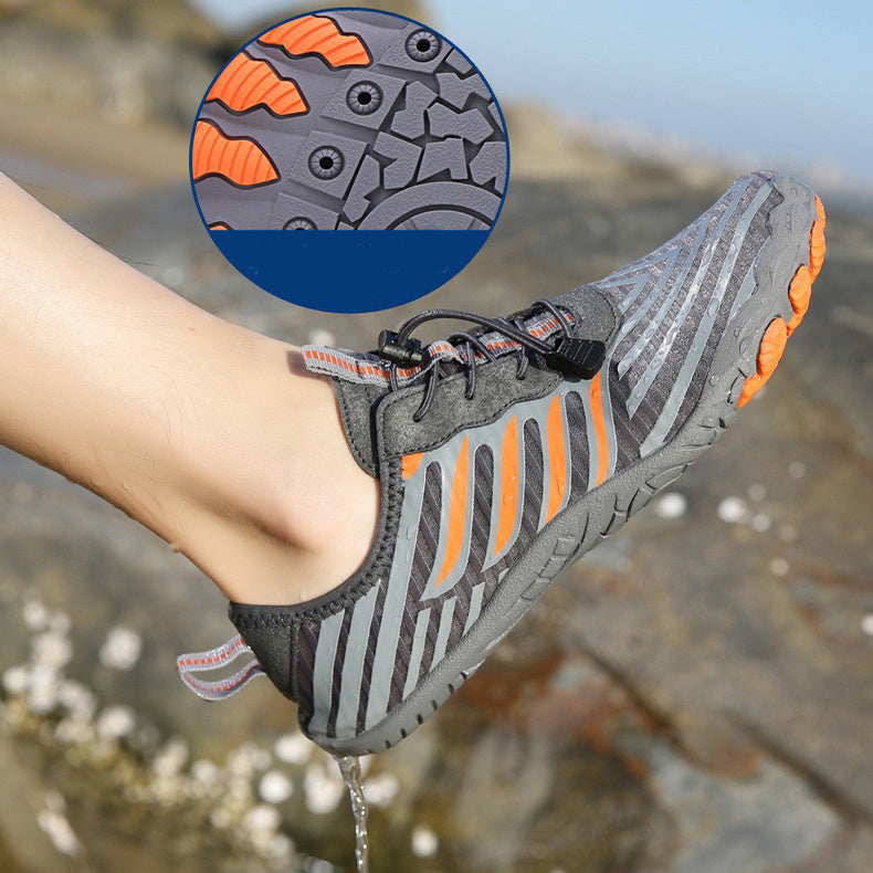 Person wearing water shoes for river wading showing non-slip grip on rocks"