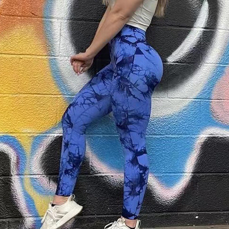Vibrant tie-dye leggings lifestyle shot showing fashion-forward activewear style