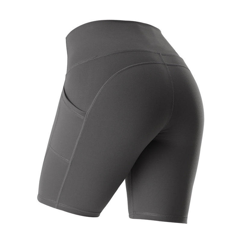 High-waist leggings with pockets showing premium construction and hip-lifting technology